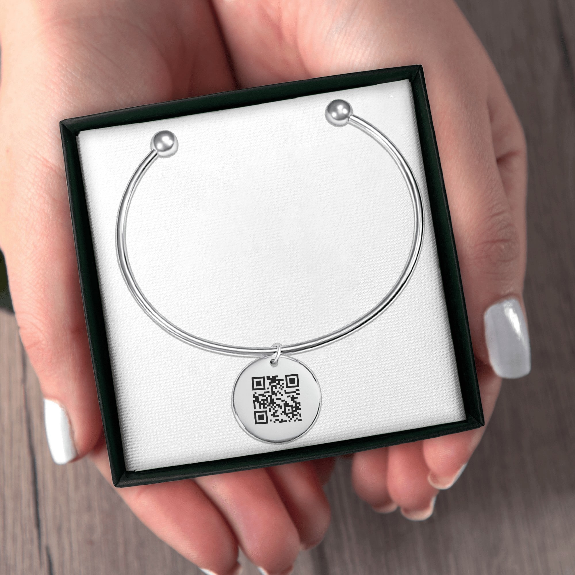 The bangle bracelet in the box it is posted in.