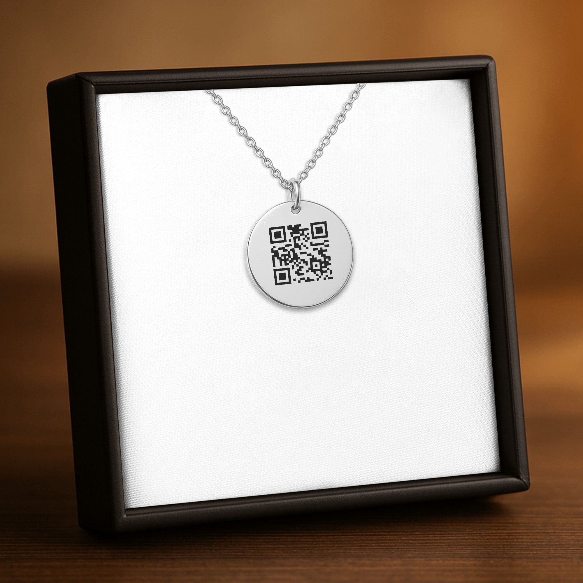 The coin pendant in the box it is posted in.