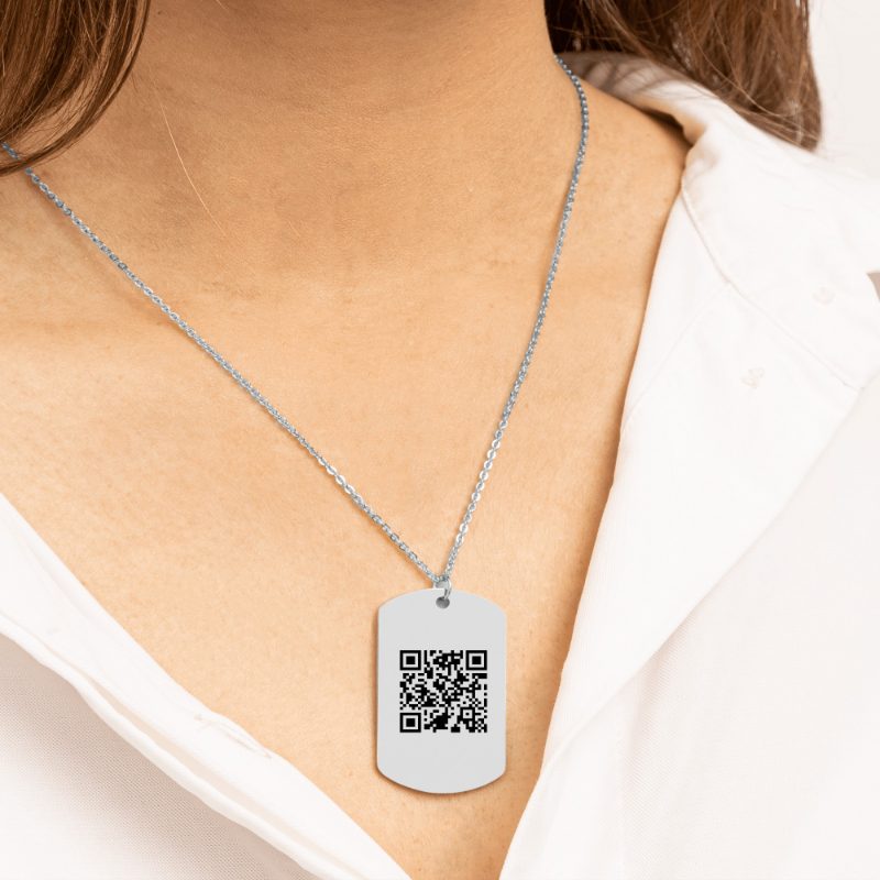 A stainless steel tag pendant on a chain, engraved with a QR code.